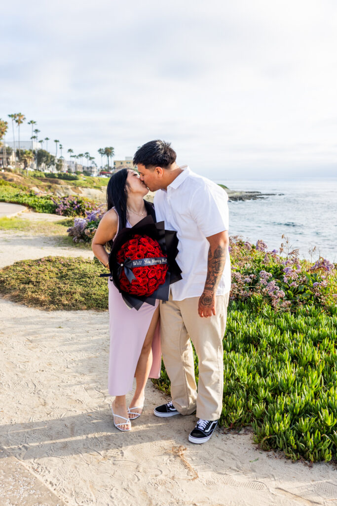 A Low-Key La Jolla Proposal with 50 Red Roses and Family Waiting Nearby engagements in san diego 4